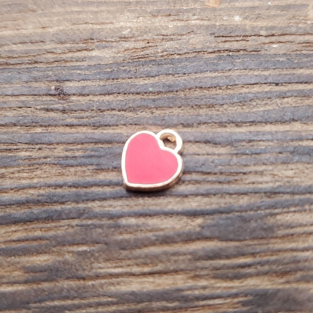 Tiny red heart charm P115